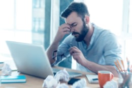 stressed person at a desk